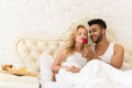 Young Couple Lying In Bed Eat Breakfast Morning With Red Rose Flower, Happy Smile Hispanic Man And Woman Royalty Free Stock Photo