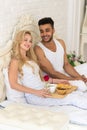 Young Couple Lying In Bed Eat Breakfast Morning With Red Rose Flower, Happy Smile Hispanic Man And Woman Royalty Free Stock Photo