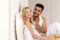 Young Couple Lying In Bed Eat Breakfast Morning With Red Rose Flower, Happy Smile Hispanic Man And Woman Royalty Free Stock Photo