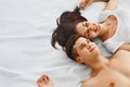 Young couple lying on bed together Royalty Free Stock Photo