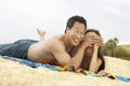 Young couple lying down on beach Royalty Free Stock Photo