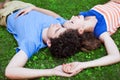Young couple lying on grass Royalty Free Stock Photo