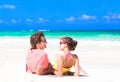 Young couple lying on sand under sunny summer sun Royalty Free Stock Photo