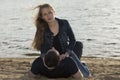 Young couple lying on the sandy beach Royalty Free Stock Photo