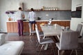 Young couple making breakfast in the morning in kitchen