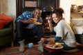 Young couple making toast on open fire Royalty Free Stock Photo