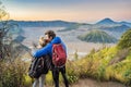 Young couple man and woman meet the sunrise at the Bromo Tengger Semeru National Park on the Java Island, Indonesia Royalty Free Stock Photo