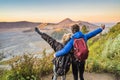 Young couple man and woman meet the sunrise at the Bromo Tengger Semeru National Park on the Java Island, Indonesia Royalty Free Stock Photo