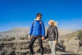 Young couple man and woman visit the Bromo volcano at the Tengger Semeru National Park on the Java Island, Indonesia Royalty Free Stock Photo