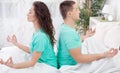 Young couple meditating together in their bedroom Royalty Free Stock Photo