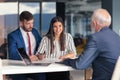 Young couple meeting financial advisor for home investment Royalty Free Stock Photo