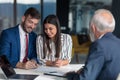 Young couple meeting financial advisor for home investment Royalty Free Stock Photo