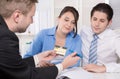 Young couple in a meeting - insurance or bank