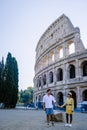 young couple mid age on a city trip in Rome Italy Europe, Colosseum Coliseum building in Rome, Italy Royalty Free Stock Photo