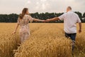 Young couple middle of the wheat field