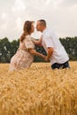 Young couple middle of the wheat field