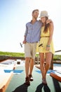 Young couple, mini golf and happy summer, relax and fun activity in sunshine. Man, woman and partner playing outdoor Royalty Free Stock Photo