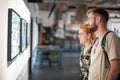 Young couple in modern art exhibition gallery hall Royalty Free Stock Photo