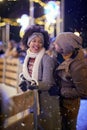 A young couple in moment of closeness at ice rink. Skating, closeness, love, together