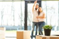 Young couple moves to a new home. the family carries boxes of things after buying a home.