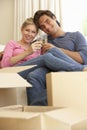 Young Couple Moving Into New Home Celebrating With Champagne Royalty Free Stock Photo