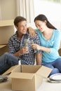 Young Couple Moving Into New Home Celebrating With Champagne Royalty Free Stock Photo