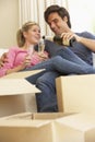 Young Couple Moving Into New Home Celebrating With Champagne Royalty Free Stock Photo