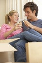 Young Couple Moving Into New Home Celebrating With Champagne Royalty Free Stock Photo