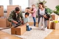 Young couple moving in a new home with their children helping them Royalty Free Stock Photo