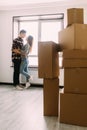 Young couple moving to a new apartment together relocation. Young couple hugging in new place after moving. Royalty Free Stock Photo