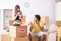 The young couple moving to new flat with fragile things Royalty Free Stock Photo