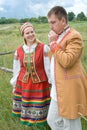 Young couple in national belarusian clothes.