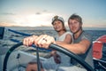 Young couple navigating on a yacht Royalty Free Stock Photo