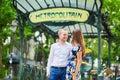 Young couple near the entrance of a metro station Royalty Free Stock Photo