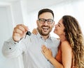 young couple new house keys buy real estate home agent agreement investment apartment owner property Royalty Free Stock Photo