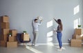 Young couple in a new house when moving. Royalty Free Stock Photo