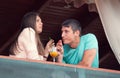 Young couple in an open-air cafe Royalty Free Stock Photo