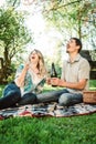 Young couple open champagne bottle Royalty Free Stock Photo