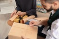 Young couple opening parcels in living room Royalty Free Stock Photo