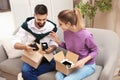 Young couple opening parcels on sofa Royalty Free Stock Photo