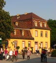 A young couple and other people strolling