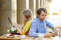 Young couple in the outdoor cafe