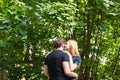 Young couple outdoor portrait. Beautiful pretty girl kissing handsome boy. Sensual photo Royalty Free Stock Photo