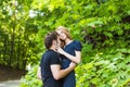 Young couple outdoor portrait. Beautiful pretty girl kissing handsome boy. Sensual photo Royalty Free Stock Photo