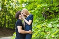 Young couple outdoor portrait. Beautiful pretty girl kissing handsome boy. Sensual photo Royalty Free Stock Photo