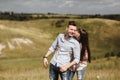 Young couple outdoor portrait. Beautiful pretty girl kissing handsome boy. Sensual photo. Royalty Free Stock Photo