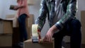 Young couple packing their things in boxes, moving from dormitory to own house Royalty Free Stock Photo