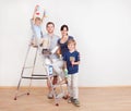 Young couple painting wall at home Royalty Free Stock Photo