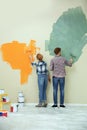 Young couple painting wall. Home repair Royalty Free Stock Photo