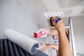 Young couple painting walls in their new house. Royalty Free Stock Photo